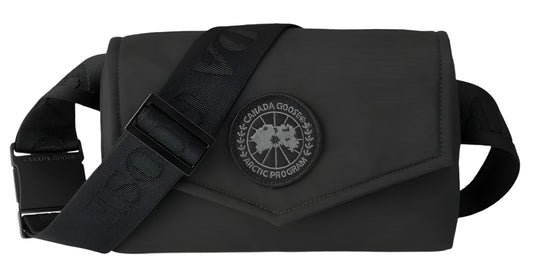 A black bag with a black strap and a circular logo.