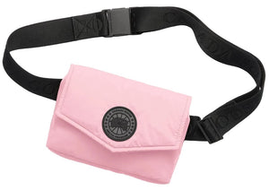 A light pink waist bag with a black Canada Goose Arctic Program logo patch on the front flap and a black adjustable strap with the brand name embossed on it.