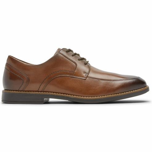 Men's light brown leather dress shoe with a lace-up closure and a dark brown sole.