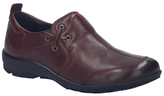 Burgundy leather slip-on shoe with decorative eyelets and a low black wedge heel.