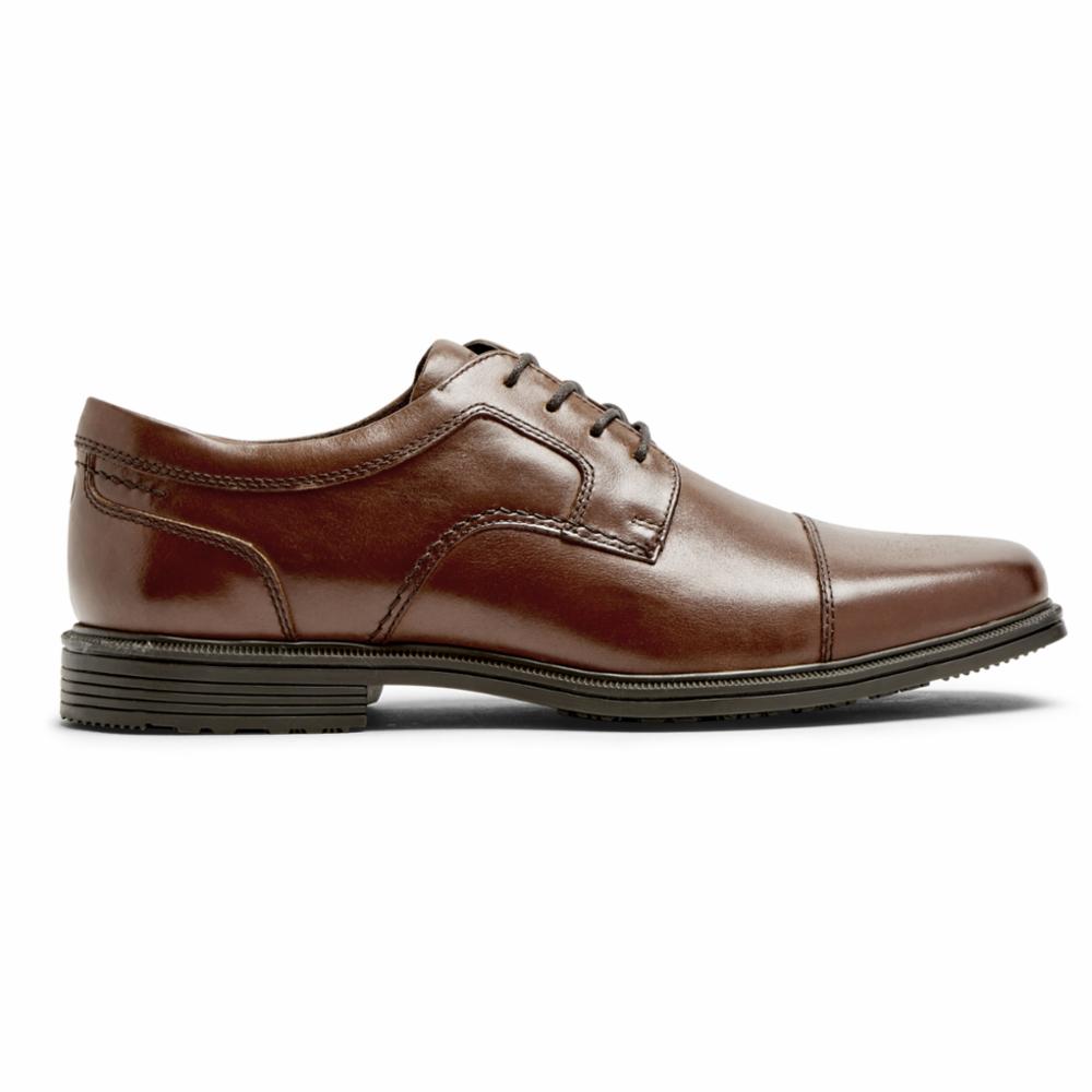 Brown leather cap-toe dress shoe with lace-up closure and dark sole.