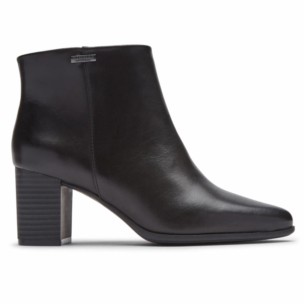 Black leather heeled bootie with block heel and pointed toe.