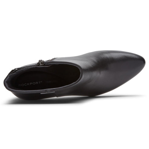 Black leather ankle boot, inside view, showing the insole, zipper closure at the heel, and pointed toe.