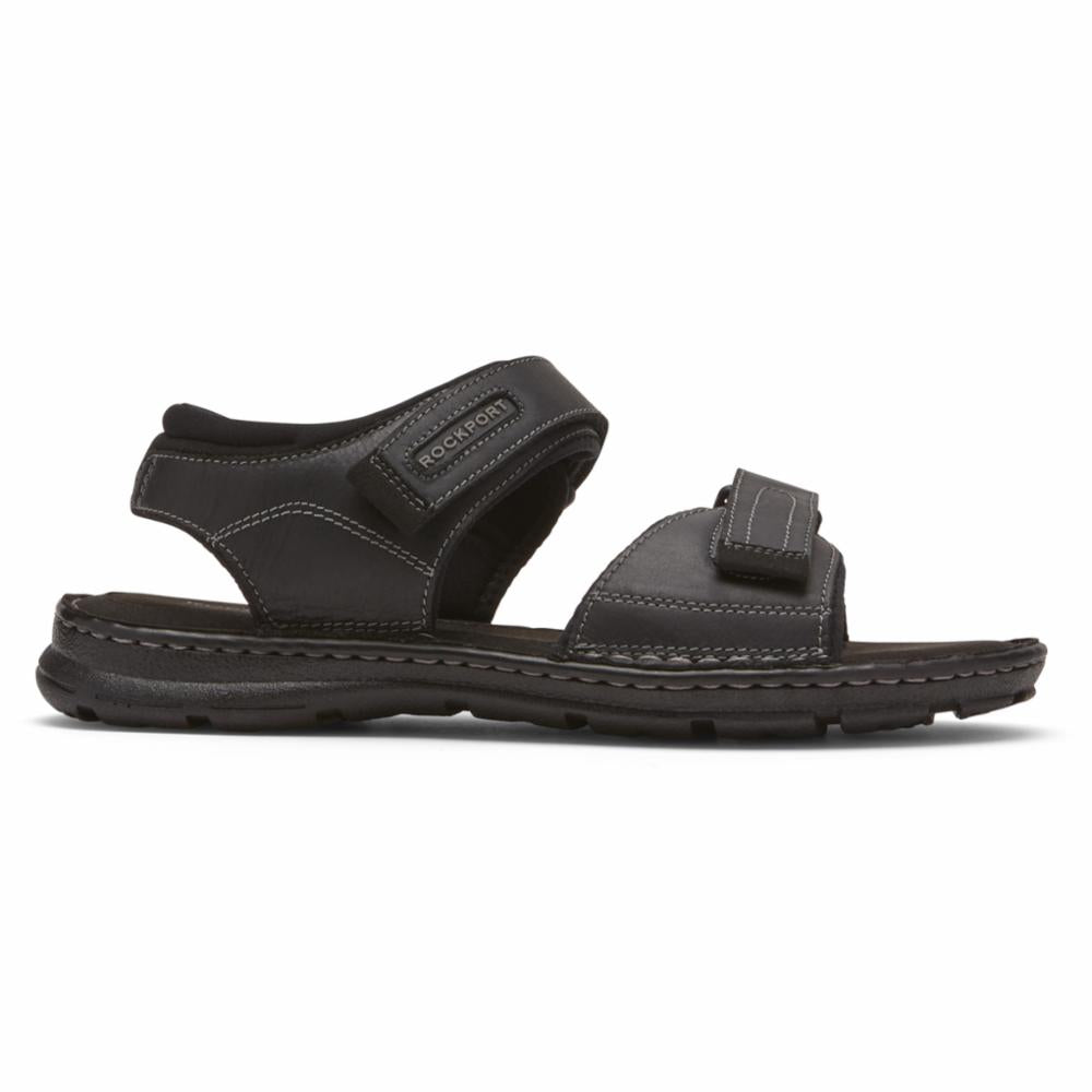 Black sandal with adjustable velcro straps.
