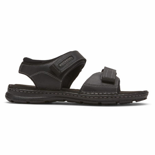 Black sandal with adjustable velcro straps.