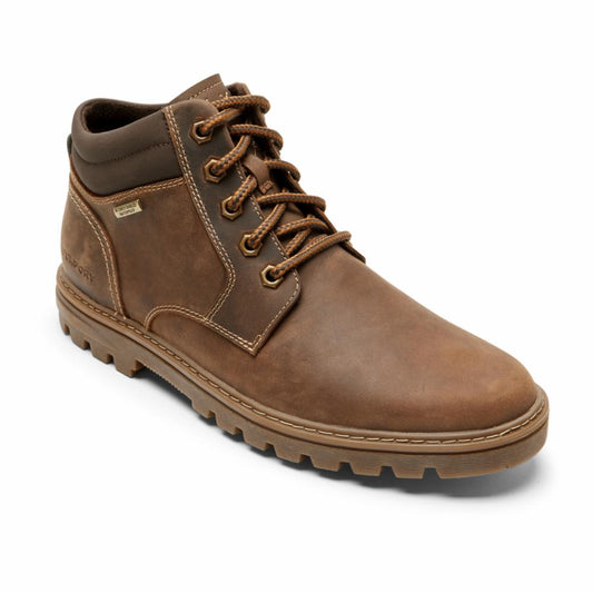 Brown leather lace-up ankle boot with lug sole.