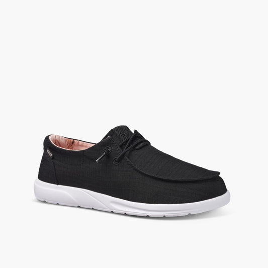 Black slip-on sneaker with white sole and pink interior.