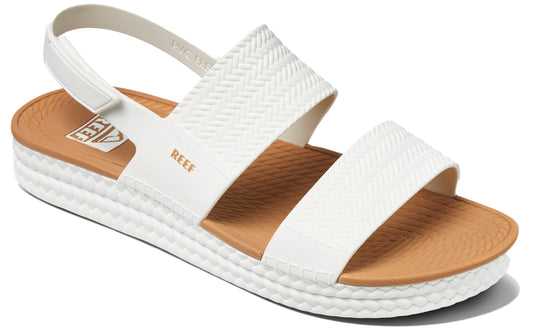 White sandal with textured straps and REEF logo.