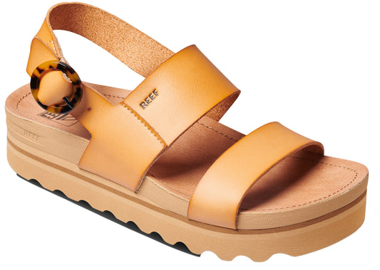 Platform sandal with tan leather straps and tortoise shell buckle.