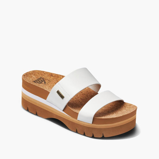 White sandal with a cork platform and two straps.