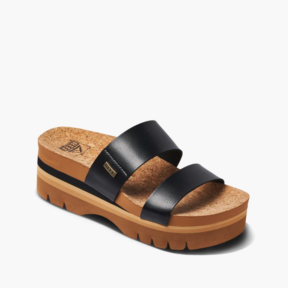 Platform sandal with black straps, cork footbed, and brown sole.