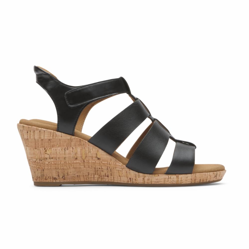 Black sandal with horizontal straps and cork wedge heel.