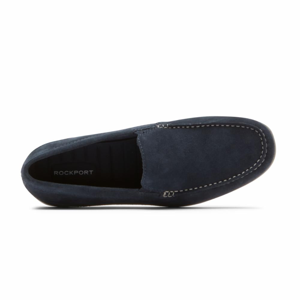 Navy suede loafer with visible white stitching.