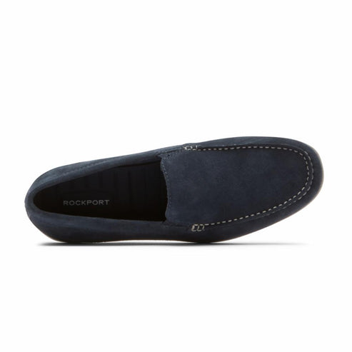 Navy suede loafer with visible white stitching.