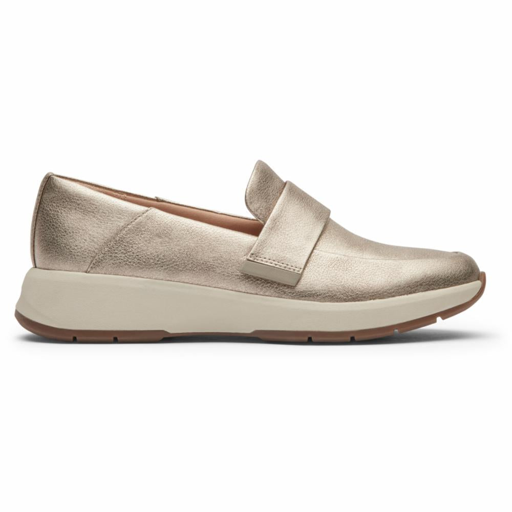 Metallic gold loafer-style shoe with a wide band and a thick, cream-colored sole.