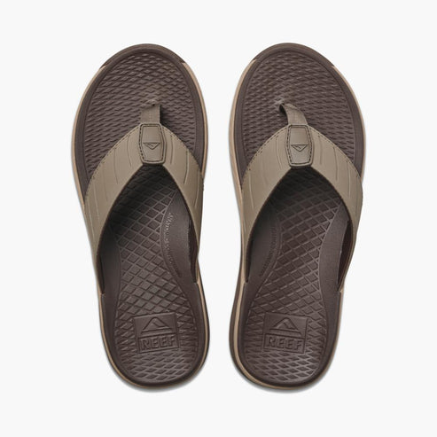 Pair of brown flip-flops with diamond pattern footbeds and straps.