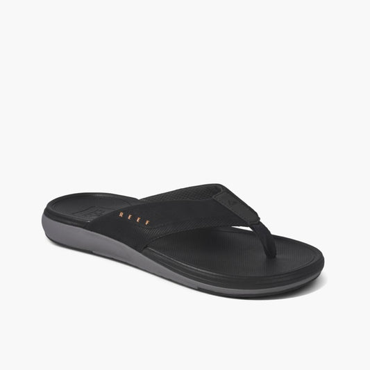 A black sandal thong with gray sole.