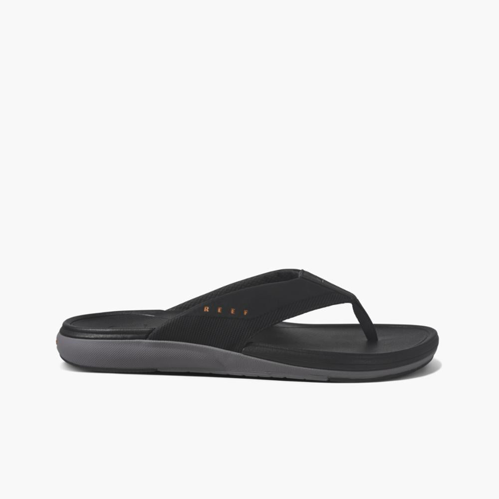 Black thong sandal with textile strap and grey sole.
