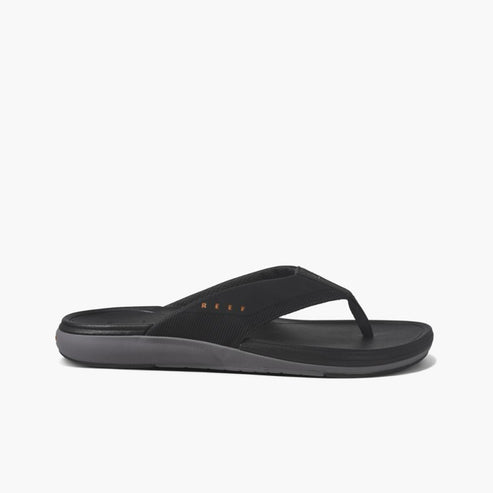 Black thong sandal with textile strap and grey sole.