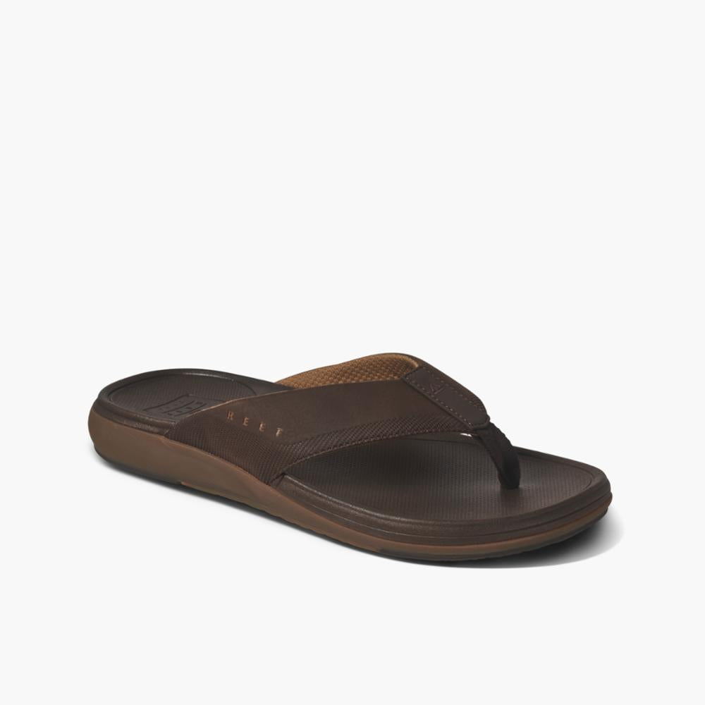 A brown flip-flop with a synthetic upper and a textured footbed.
