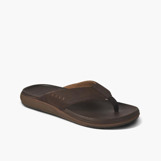 A brown flip-flop with a synthetic upper and a textured footbed.
