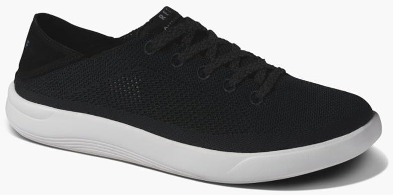 Black sneaker with white sole and black laces.