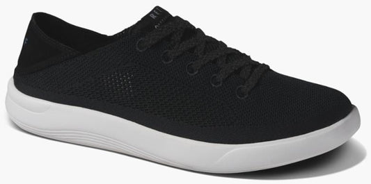 Black sneaker with white sole and black laces.