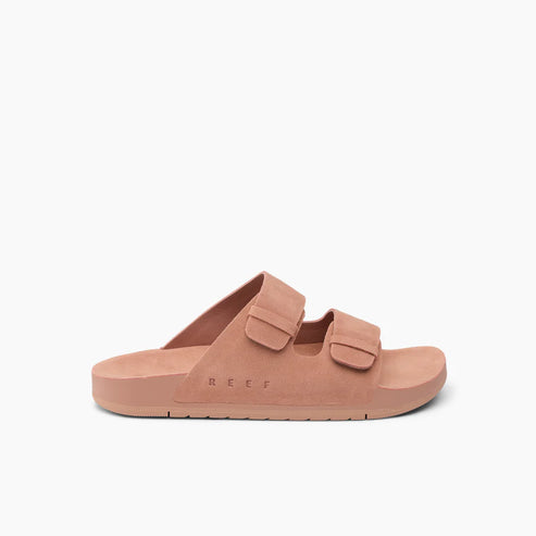 Light brown slides with two adjustable straps and "REEF" text on side.
