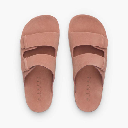 Pair of flat, dusty rose colored, two-strap slide sandals.