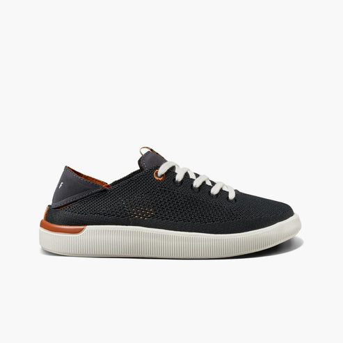 Charcoal knit sneaker with a white sole and brown accents.