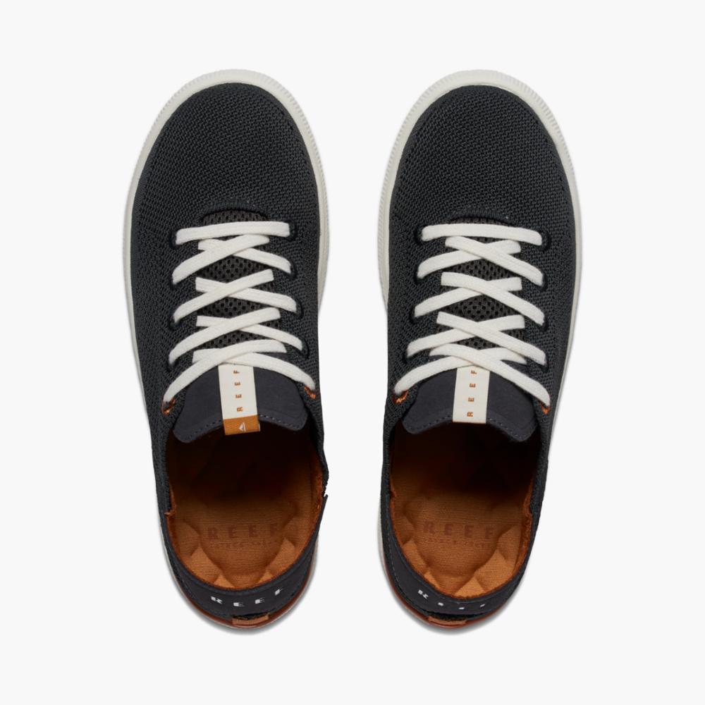 A pair of low-top knit sneakers with white laces.