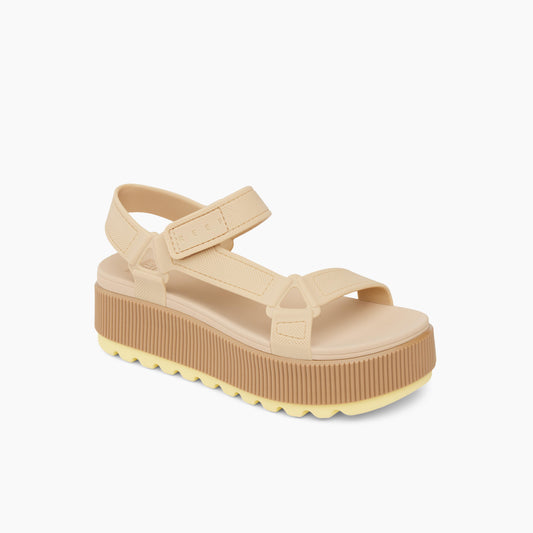Beige platform sandal with velcro straps.