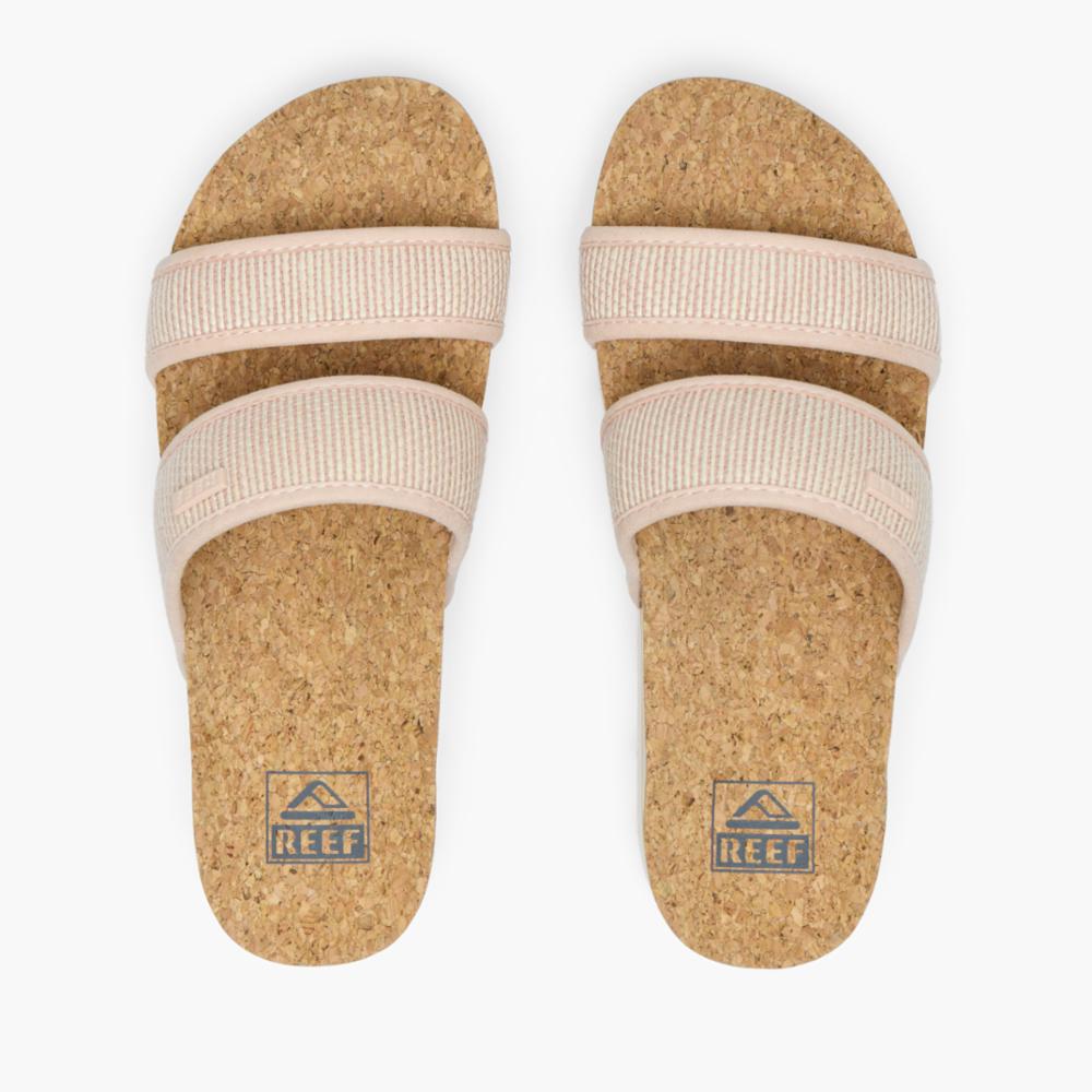 Pair of slide sandals with cork footbeds and light pink double straps.