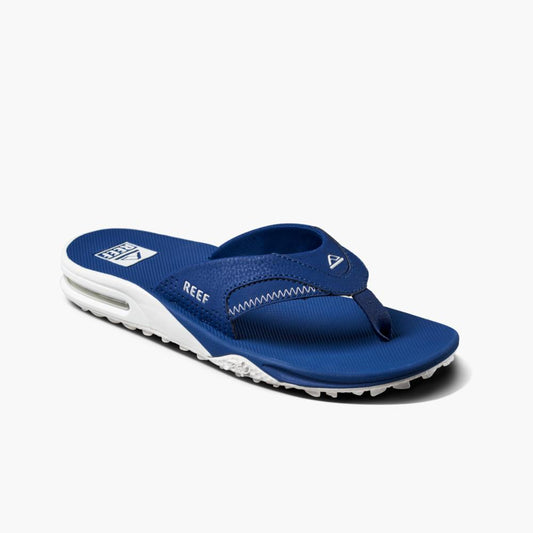 Blue flip-flop with a white sole and the word "REEF" on the side.