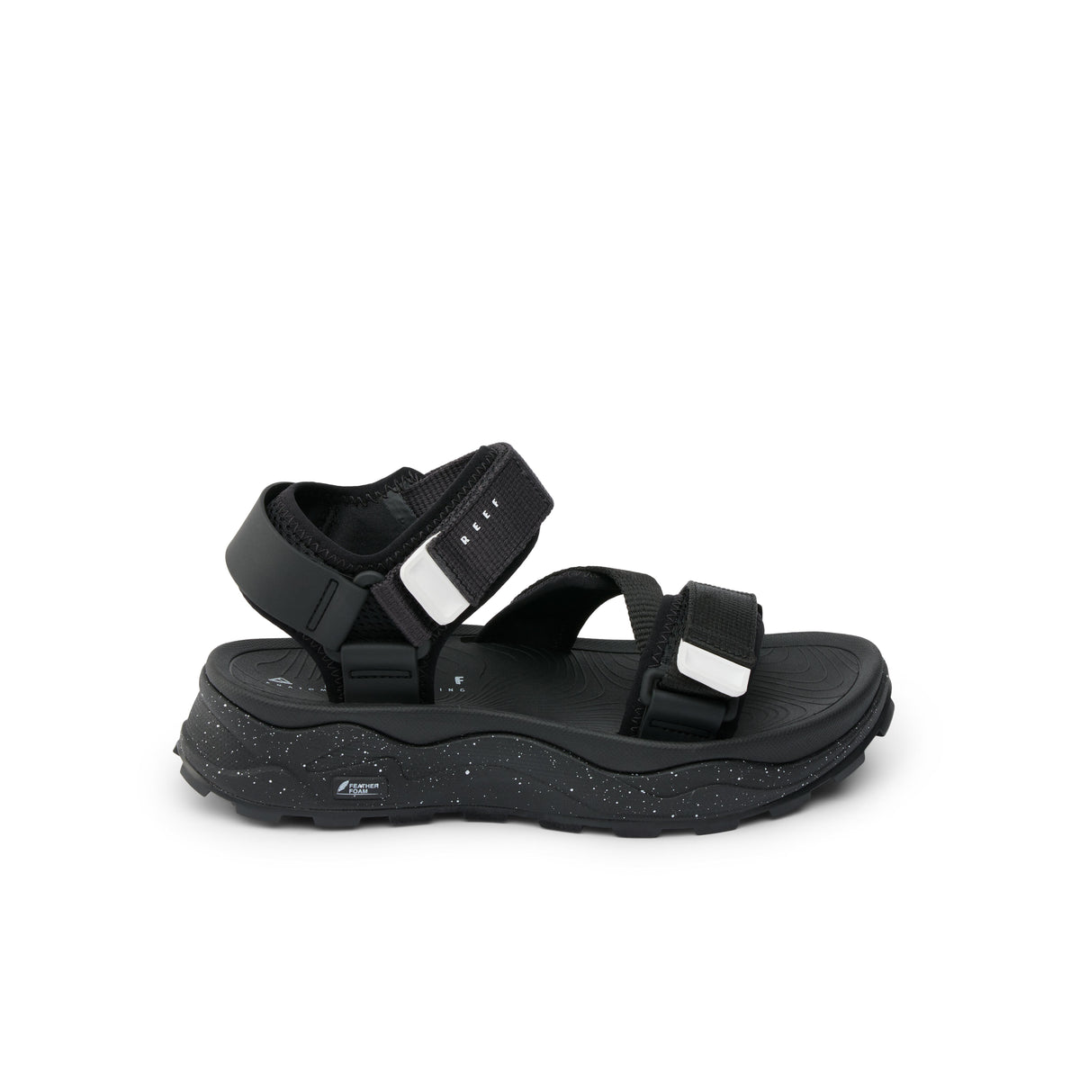 Black platform sandal with velcro straps.