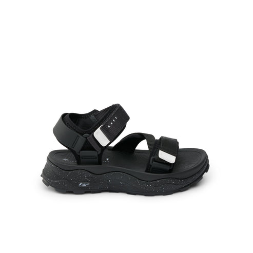 Black platform sandal with velcro straps.