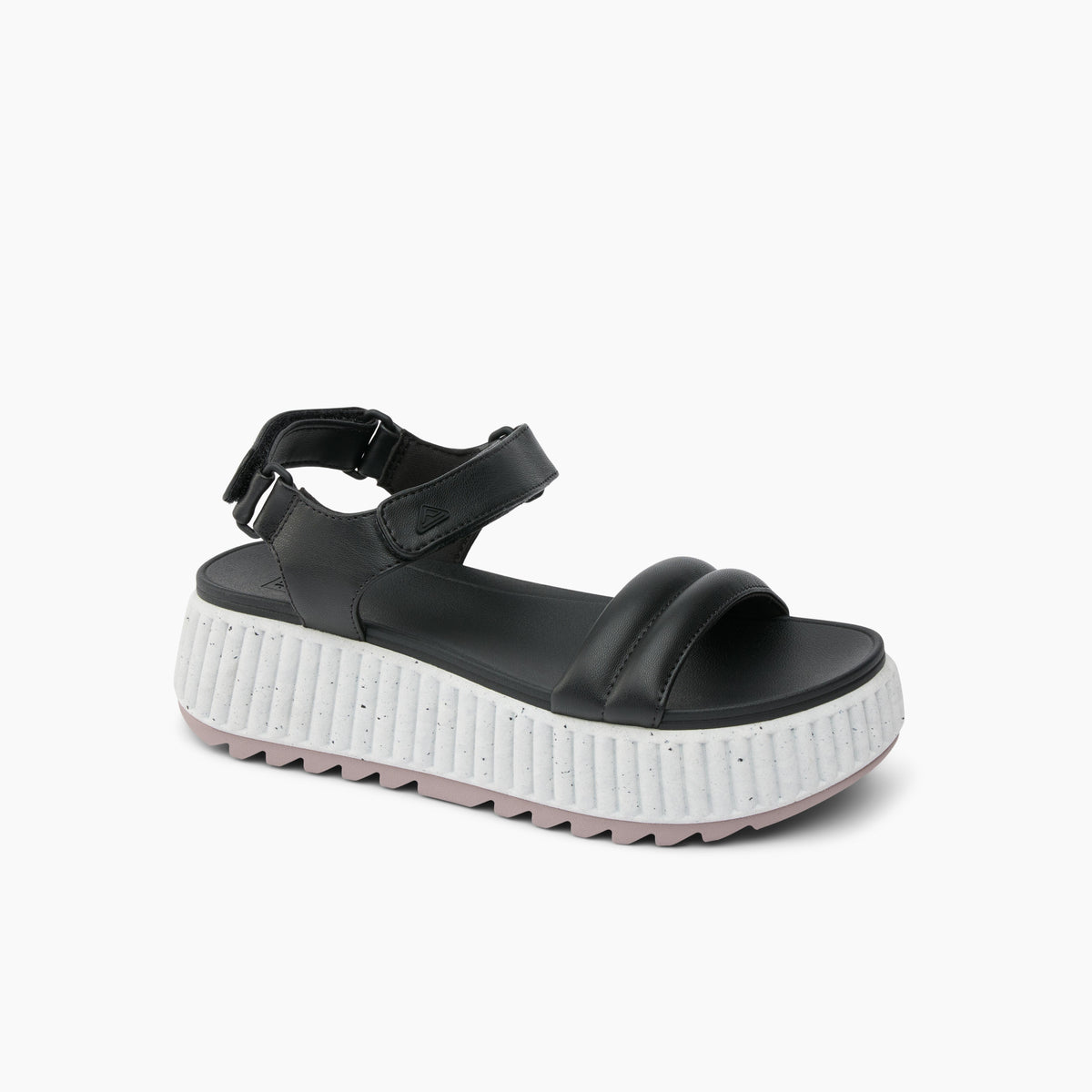 Black platform sandal with velcro ankle strap and thick white sole.