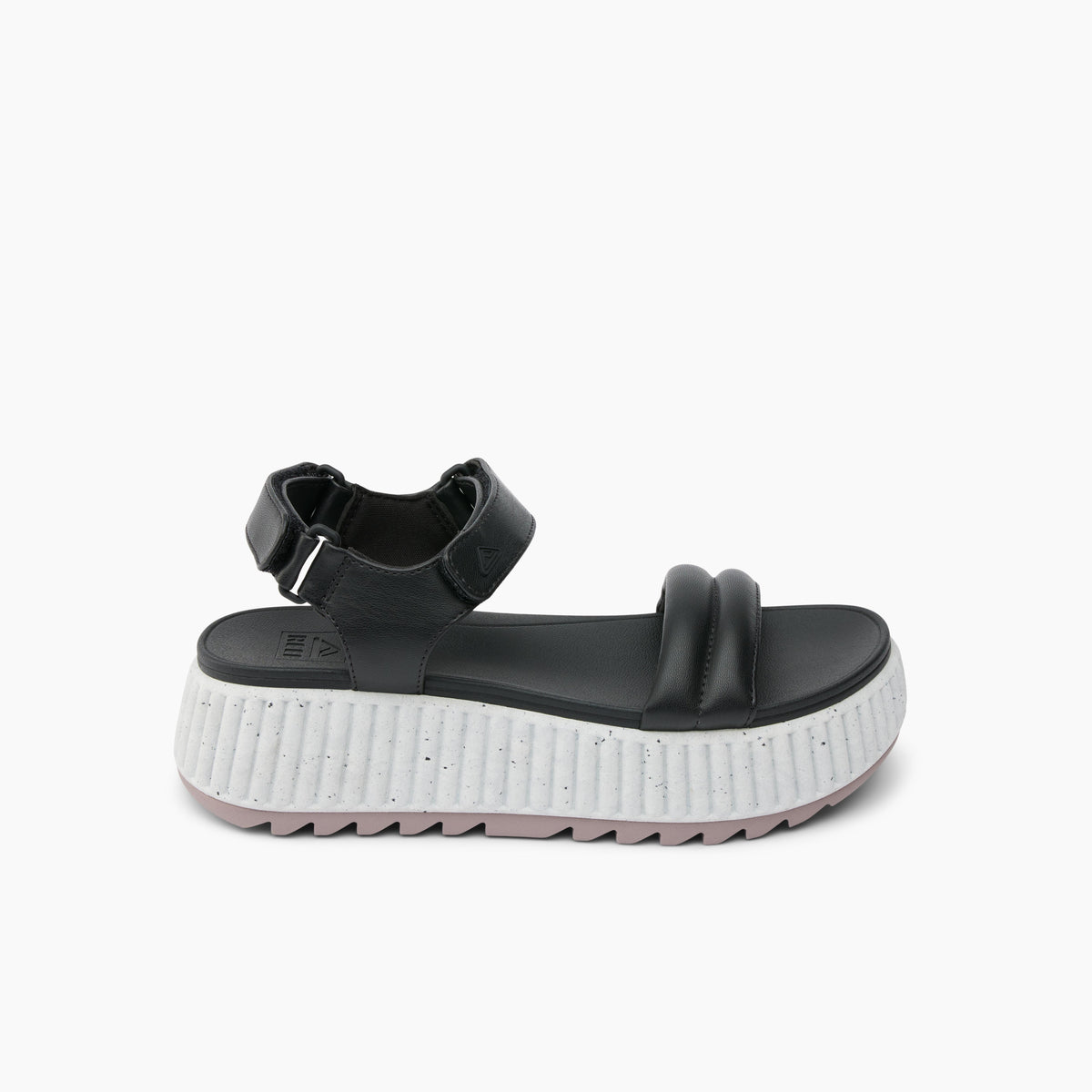 Black sandal with a hook-and-loop closure and a thick, ridged white and gray sole.
