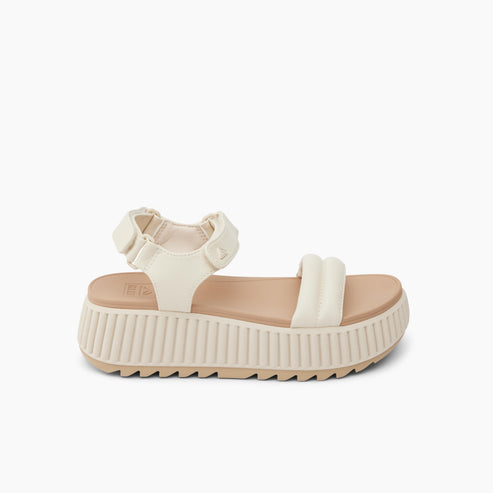 White platform sandal with padded straps.