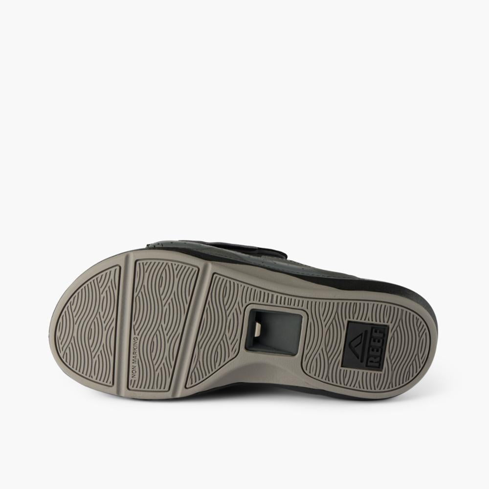 Sandal sole featuring a bottle opener.