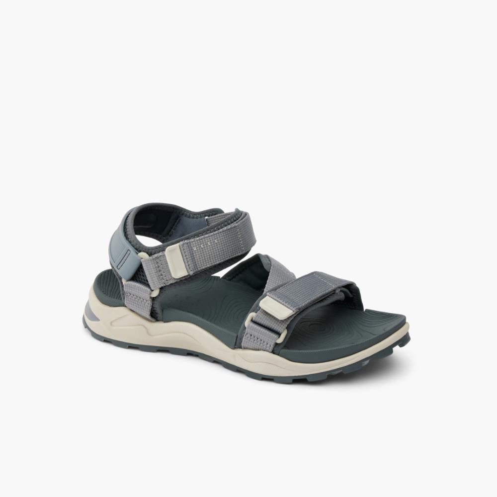 Gray sandal with adjustable straps and thick, tan and gray sole.