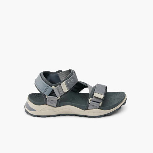 Gray sandal with straps and buckle.