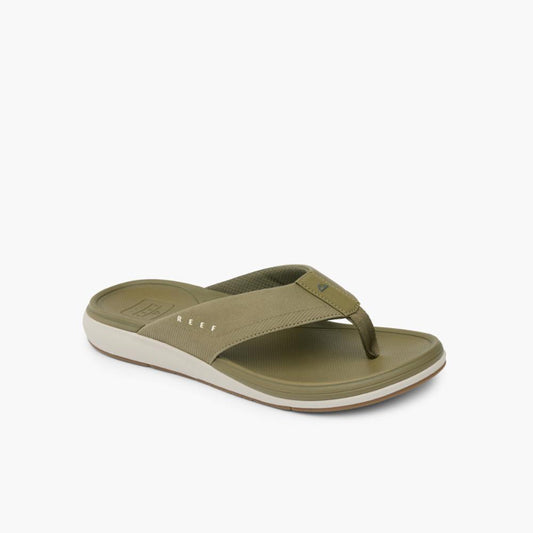 Olive green sandal with visible white midsole and branding near the foot arch