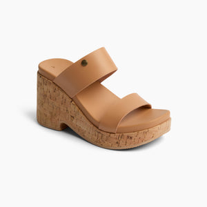 Tan slide-on sandal with a cork wedge heel.