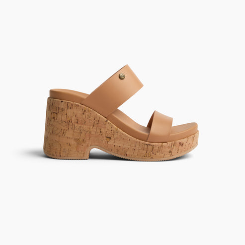 Tan platform sandal with cork heel and dual straps.