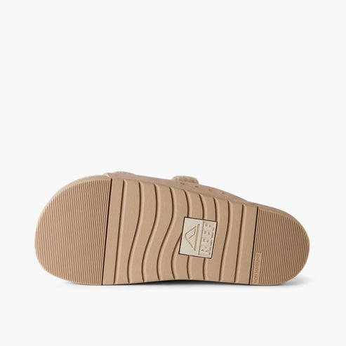 Tan sandal with wavy treads.