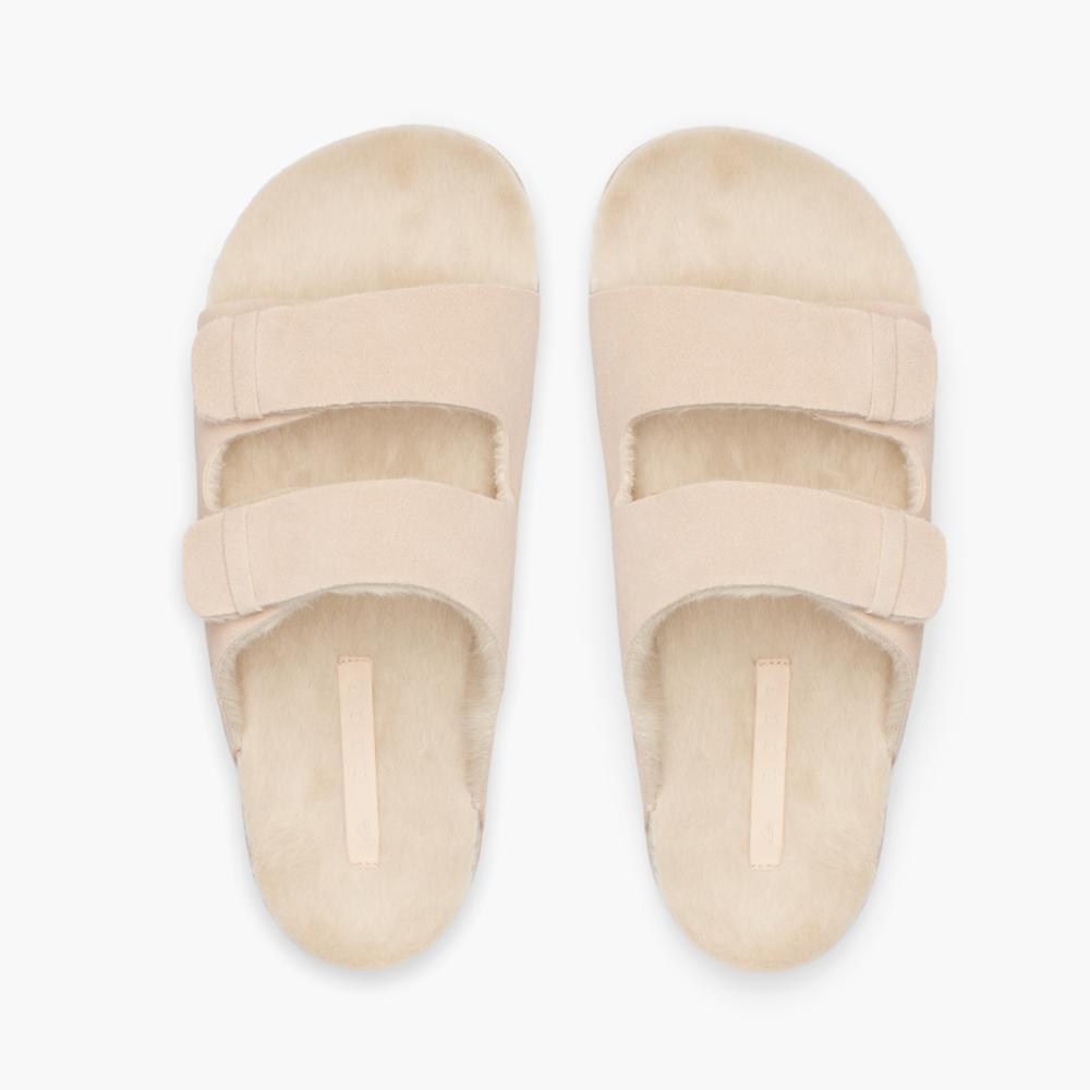 Beige fluffy two-strap slide sandals.