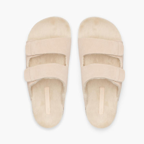 Beige fluffy two-strap slide sandals.