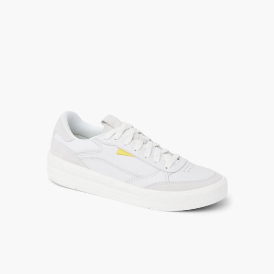Low-top white leather sneaker with yellow accent.