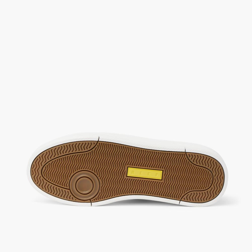 Sneaker sole with brown rubber and yellow rectangle logo.
